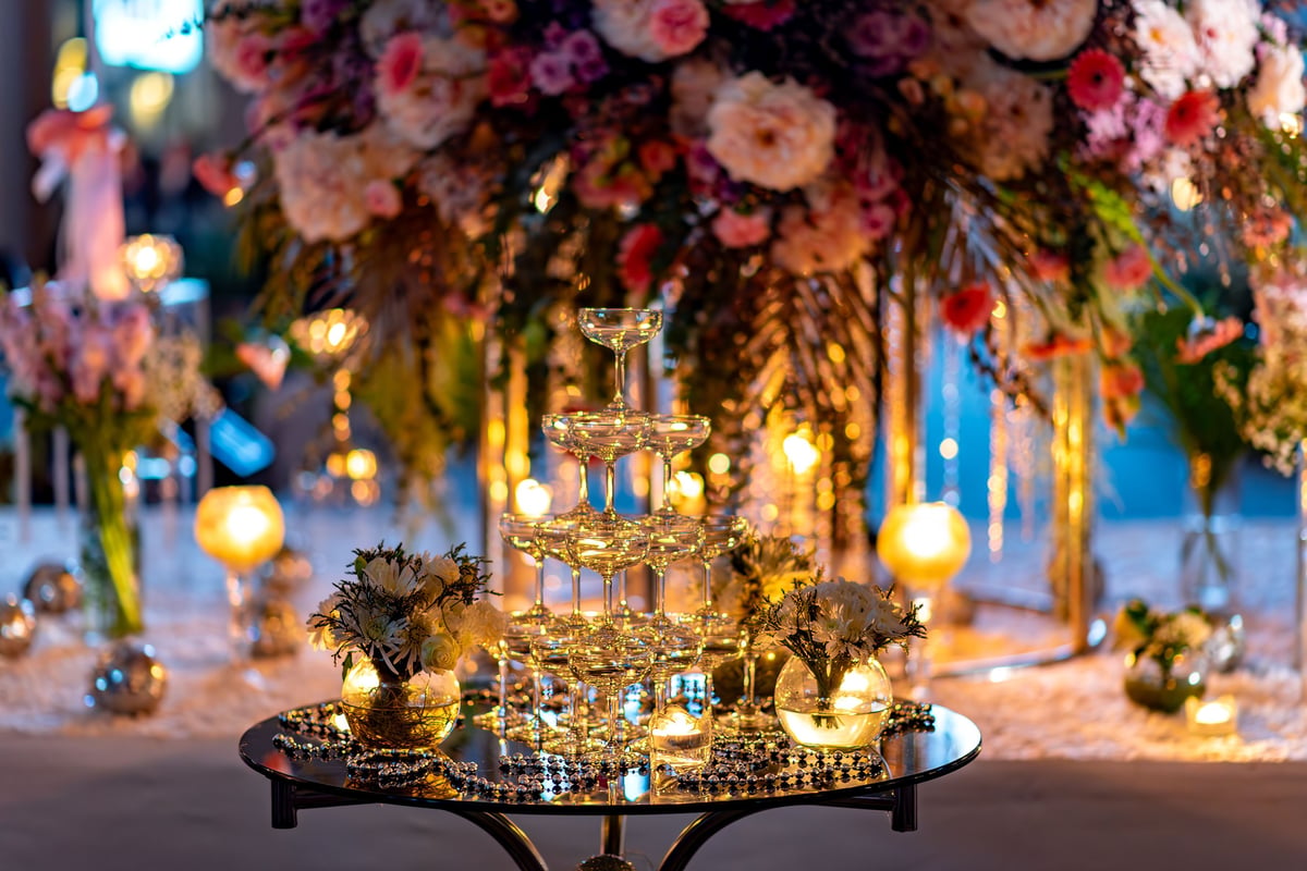 Elegant wedding table with champagne tower and flowers